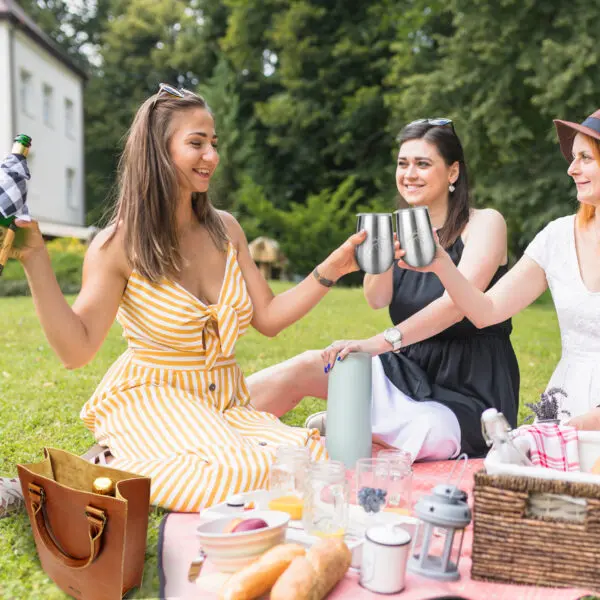 Three Women Sitting With a Two Wine Bottle Fit Tote Bag